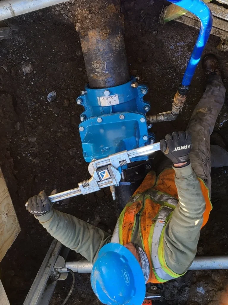 Flowline Solutions technician performing live pipeline work in Texas
